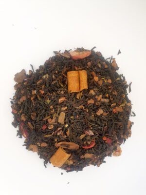 Té Negro Jardín Rojo Chocolate con cacao, frambuesa, arándanos y canela sobre fondo natural.
